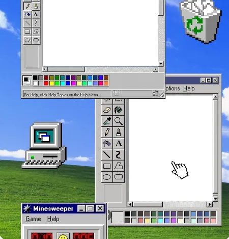 Collage de Windows XP con Paint, Buscaminas y la papelera sobre la colina verde.